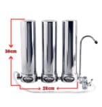 Three chrome water filter canisters in a row with a dedicated faucet on the right, showing overall height 30 cm and width 28 cm.