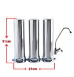 Triple stainless-steel water distiller unit with a side faucet; overall width 27 cm and height 31 cm.