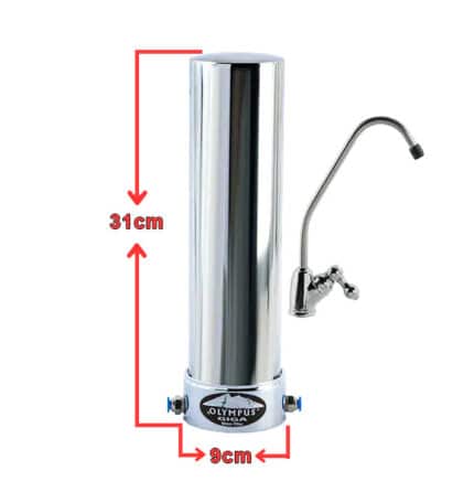 Tall stainless steel water filter column with side faucet; ~31 cm tall and 9 cm diameter (Olympus).