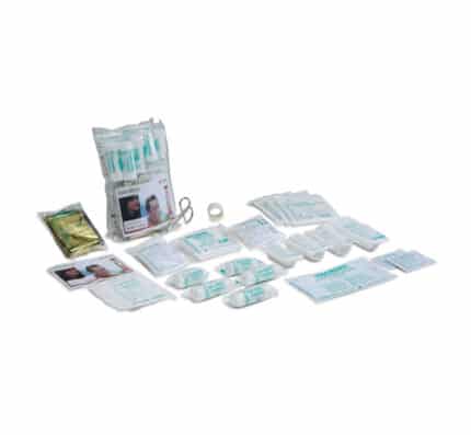 A kit and assorted wound-care supplies (bandages, gauze, tapes, antiseptics) laid out for first-aid use